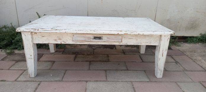 old wooden coffee table, in white color, with a drawer