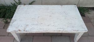 old wooden coffee table, in white color, with a drawer
