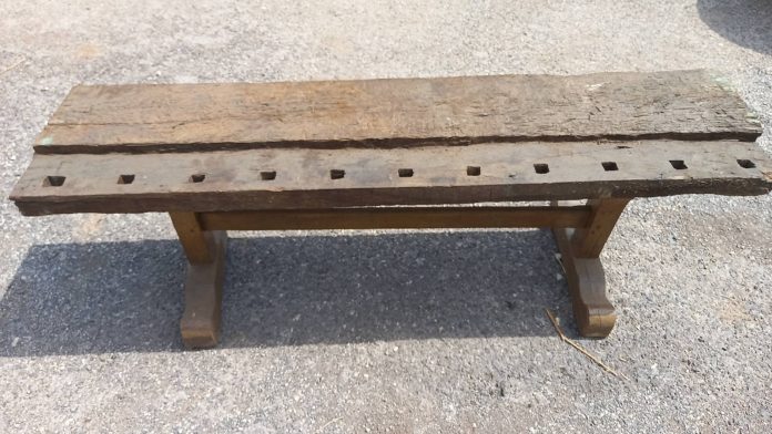 wooden bench handmade out of a carpenter 's old working bench , elaborate legs , antique ,vintage