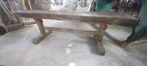wooden bench handmade out of a carpenter s working bench , elaborate legs , antique ,vintage