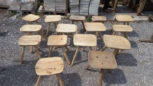 small  three-legged wooden seats ,old stools, handmade