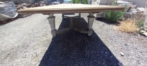 old wooden table ,with curved white legs , can be extended