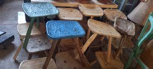 small  three-legged wooden seats ,old stools, handmade