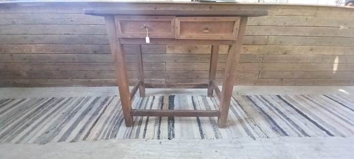old wooden table, desk , in dark color, handmade from oak wood , with 2 drawers with metal knobs
