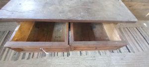 old wooden table, desk , in dark color, handmade from oak wood , with 2 drawers with metal knobs