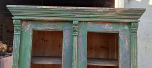 old wooden window case-bookcase ,green color, restored , handmade , curved on the top corners and the top part of the door