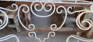 old iron entrance table , handmade, with circular designs , white