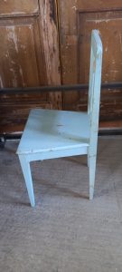 old wooden chair, in a light blue color , handmade