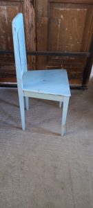old wooden chair, in a light blue color , handmade