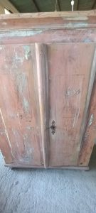 old wooden wardrobe, closet, , with two doors, in a light pink color, with a heavy, particular lock which also serves as a knob, handmade, restored
