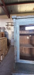 old wooden sideboard, kitchen furniture, with cupboards with windows on the top part of the furniture, drawer and storing space at the bottom (cupboards)