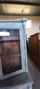 old wooden sideboard, kitchen furniture, with cupboards with windows on the top part of the furniture, drawer and storing space at the bottom (cupboards)
