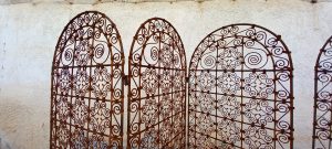 pair of old iron screens, old pair of folding screens out of cast iron, hand forged on fire, elaborately decorated with spirals, unique piece