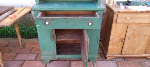 old wooden sideboard in a vivid green color, old wooden kitchen cabinet, cupboard, dish rack, spice rack, handmade, heavily built piece of furniture