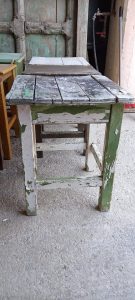 old wooden seats , stools in different colors, small seats ,old antique seats ,handmade , old handmade wooden furniture