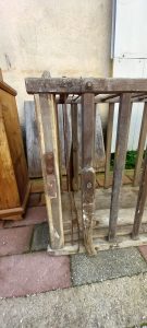 old wooden cage, antique wooden container for domestic animals , with handles so it can be moved easily and 2 doors on either side which slide upwards in order to open up, handmade house tool