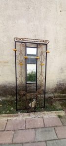 old iron coat and hat stand with a mirror,  umbrella case and shelf, wooden hangers, decorated with spirals, colored in 2 colors ( black and bronze), coat stand, umbrella case-holder, side table