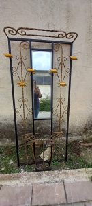 old iron coat and hat stand with a mirror,  umbrella case and shelf, wooden hangers, decorated with spirals, colored in 2 colors ( black and bronze), coat stand, umbrella case-holder, side table
