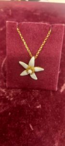 Necklace with the orange blossom in silver 925 gold plated with white enamel in the center (total chain length 50cm and 56cm)