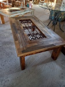coffee table from old pieces of wood from old furniture that could not be restored natural color, with an old iron railing in the center which will be covered with glass (not included), sitting room /living room small table, the frame is from an old door case in an warm natural color