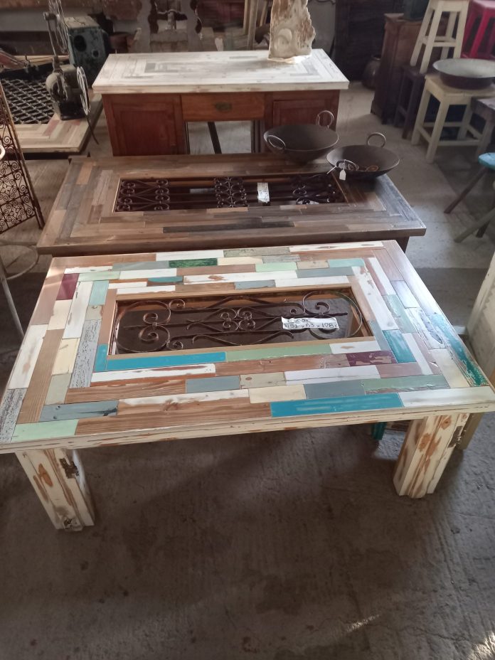 coffee table from old colorful pieces of wood from old furniture that could not be restored, with an old iron railing in the center which will be covered with glass (not included), sitting room /living room small table, the frame is from an old door case in an washed out white color