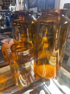 old glass bottles, old glass vessels, demijohns , carboys, bottles, flasks, jars, pots, phials, ampoules and other containers, of glass different shapes, sizes, colors and prices